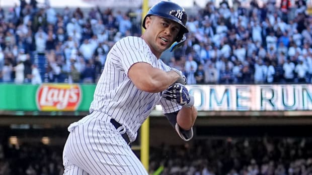Giancarlo Stanton rounds third base after hitting a three-run homer in Game 5 of the ALDS.